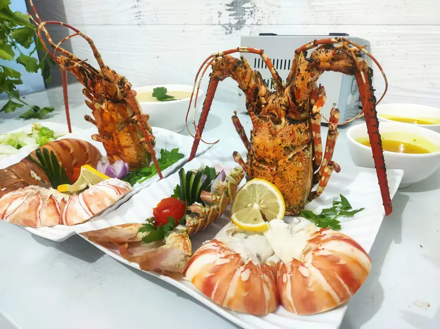 Fresh seafood dinner spread at Parapat Water Village Resort on the Celebes Sea