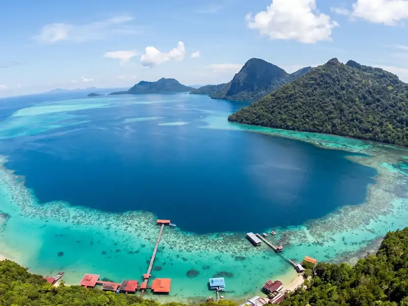 Island hopping around the Tun Sakaran Marine Park with Parapat Water Village Resort in the Celebes Sea.