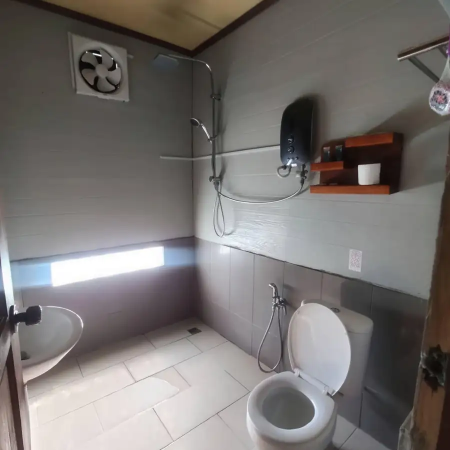 A practical simple bathroom at Parapat Water Village Resort, an over the water resort near Semporna.